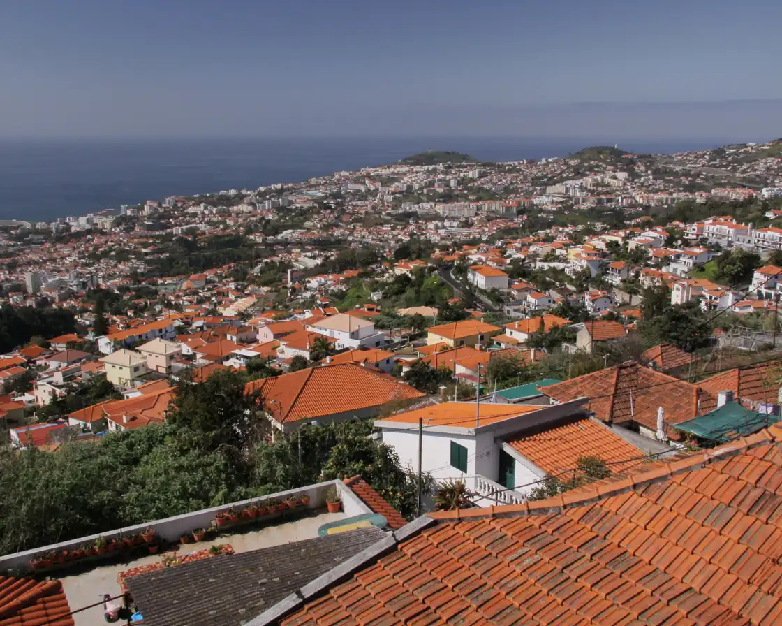 Funchal and its bay seen from Monte over terracotta roofs