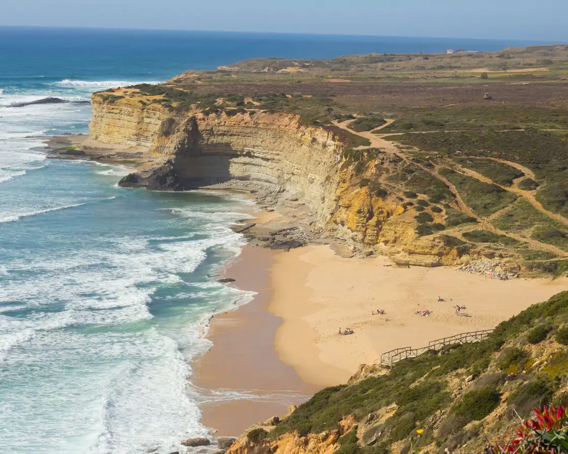 Ericeira cliffs and a beach seen from the headland with the Atlantic to the left
